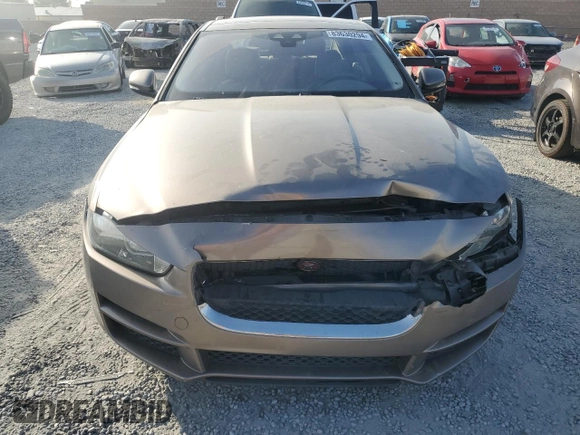 2017 Jaguar XE 25t Premium with VIN SAJAD4BG6HA957704, listed as a Copart auction lot 83630294 with 114,794 mi miles and Salvage Title. Bid and sale history available at carsss.com. Image 5.