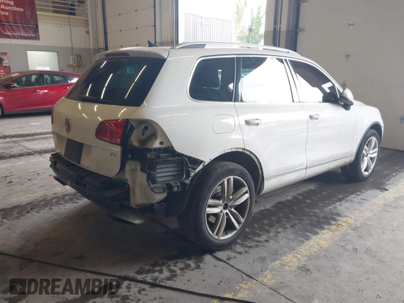 2013 Volkswagen Touareg Lux with VIN WVGEF9BP6DD007323, listed as a IAAI auction lot 41488959 with 123,383 mi miles and . Bid and sale history available at DreamBid. Image 4.