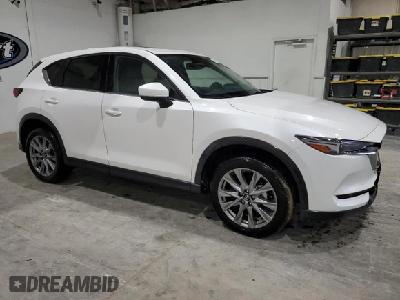 2021 Mazda CX-5 Grand Touring with VIN JM3KFBDM4M1344602, listed as a Copart auction lot 82793724 with 69,322 mi miles and Salvage Title. Bid and sale history available at carsss.com. Image 4.