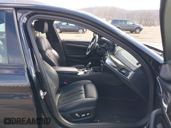 2018 BMW 5 Series M550i xDrive with VIN WBAJB9C52JB035930, listed as a IAAI auction lot 41674415 with 56,294 mi miles and . Bid and sale history available at DreamBid. Image 5.