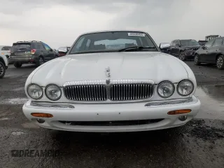 1999 Jaguar XJ with VIN SAJKD6041XC876928, listed as a Copart auction lot 60038405 with 63,917 mi miles and Clean title. Bid and sale history available at DreamBid. Image 5.