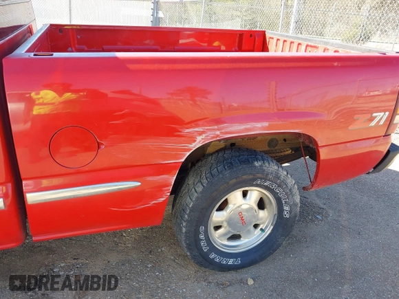 2000 GMC New Sierra 1500 SLE with VIN 2GTEK19T9Y1202371, listed as a IAAI auction lot 41806365 with 110,957 mi miles. Bid and sale history available at carsss.com. Image 12.
