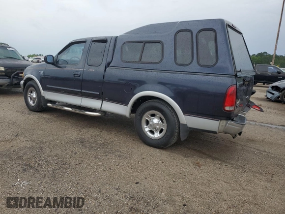 2000 Ford F-150 XL with VIN 1FTRX17L7YNC24292, listed as a Copart auction lot 58852925 with 213,318 mi miles and Salvage title. Bid and sale history available at DreamBid. Image 2.