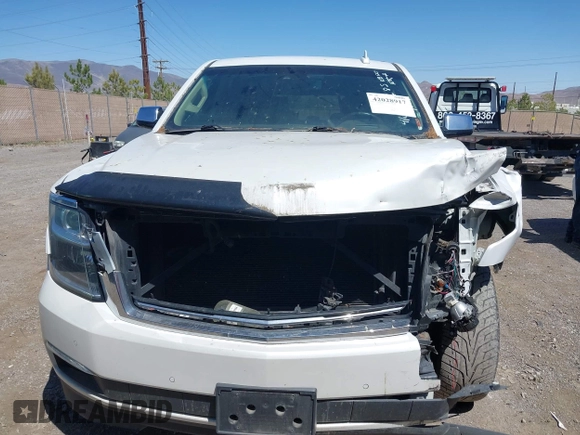 2016 Chevrolet Tahoe LTZ z VIN 1GNSKCKC8GR451685, wystawiony jako IAAI lot #42028917 z przebiegiem 73 398 mil mil oraz . Historia ofert i sprzedaży dostępna na DreamBid. Obrazek 12.