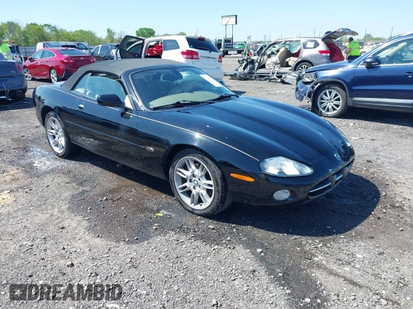 2002 Jaguar XK with VIN SAJDA42C12NA30499, listed as a IAAI auction lot 41954577 with 77,152 mi miles and . Bid and sale history available at DreamBid. Image 1.