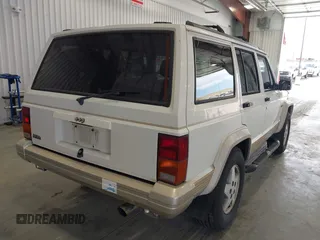 1996 Jeep Cherokee Country with VIN 1J4FT78S5TL232090, listed as a IAAI auction lot 42267272 with 255,417 mi miles and . Bid and sale history available at DreamBid. Image 4.