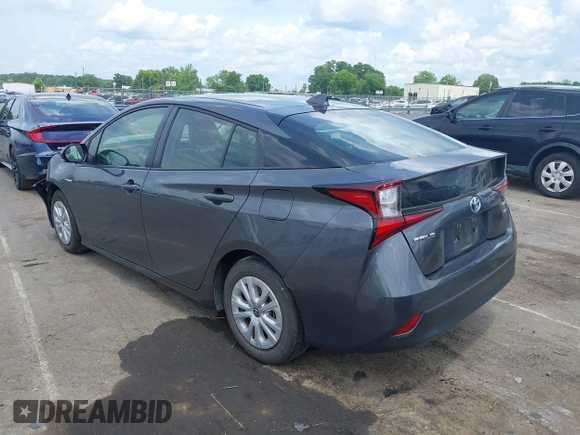 2021 Toyota Prius L Eco z VIN JTDKAMFU3M3152785, wystawiony jako IAAI lot #42501351 z przebiegiem 60 489 mil mil oraz . Historia ofert i sprzedaży dostępna na DreamBid. Obrazek 3.
