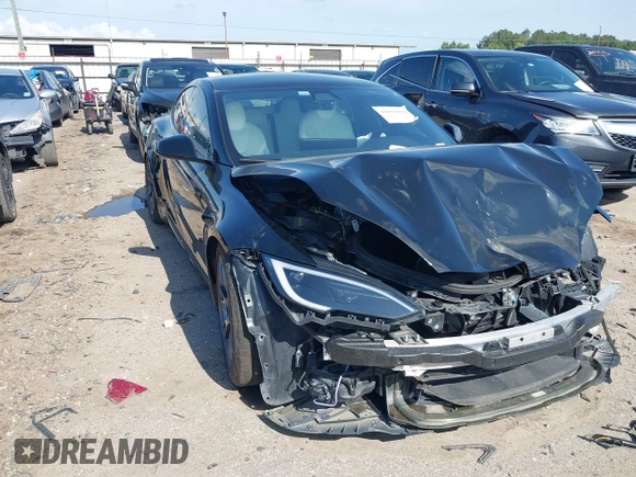2022 Tesla Model S Plaid with VIN 5YJSA1E63NF478351, listed as a IAAI auction lot 42056199 with Not provided miles and . Bid and sale history available at DreamBid. Image 1.
