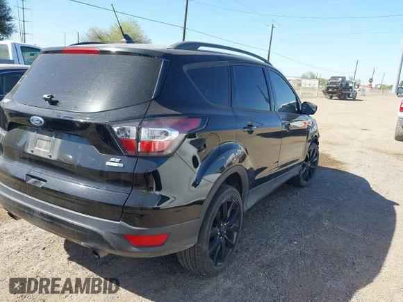2018 Ford Escape SE z VIN 1FMCU9GD3JUC75754, wystawiony jako IAAI lot #41761965 z przebiegiem 101 771 mil mil oraz . Historia ofert i sprzedaży dostępna na DreamBid. Obrazek 4.