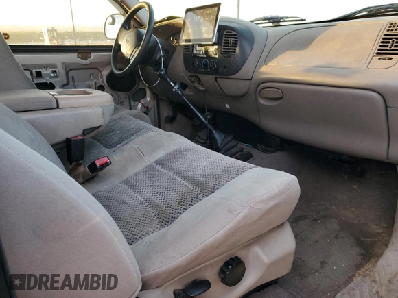2002 Ford F-150 XL with VIN 1FTRF18262NB35586, listed as a Copart auction lot 77114114 with 166,942 mi miles and Salvage title. Bid and sale history available at DreamBid. Image 8.