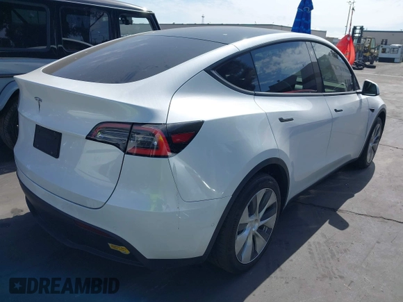 2021 Tesla Model Y Long Range with VIN 5YJYGDEE3MF081304, listed as a IAAI auction lot 41706240 with 90,510 mi miles and . Bid and sale history available at DreamBid. Image 4.