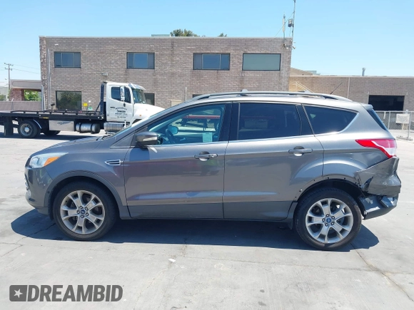 2013 Ford Escape SEL with VIN 1FMCU0HX0DUC16069, listed as a IAAI auction lot 42638924 with 80,200 mi miles and . Bid and sale history available at DreamBid. Image 14.