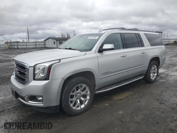 2015 GMC Yukon XL SLT with VIN 1GKS2HKC8FR616031, listed as a Copart auction lot 48740785 with 128,467 mi miles and Salvage Title. Bid and sale history available at carsss.com. Image 1.
