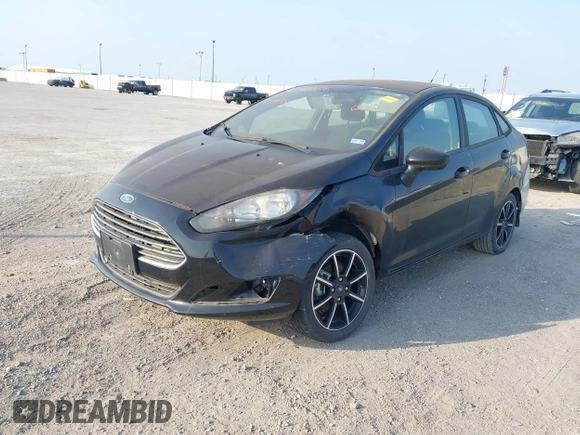 2018 Ford Fiesta SE z VIN 3FADP4BJXJM117051, wystawiony jako IAAI lot #42049956 z przebiegiem 27 367 mil mil oraz . Historia ofert i sprzedaży dostępna na DreamBid. Obrazek 2.