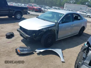 2013 Volkswagen Jetta SE with VIN 3VWDX7AJ3DM404990, listed as a IAAI auction lot 42584934 with 164,126 mi miles and . Bid and sale history available at DreamBid. Image 2.