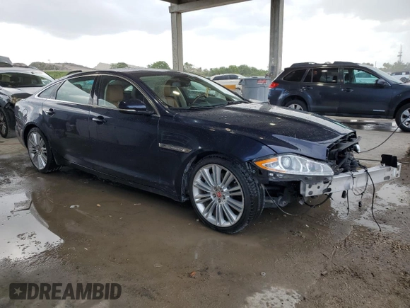 2015 Jaguar XJ Portfolio with VIN SAJWJ2GD2F8V90287, listed as a Copart auction lot 50291095 with 46,917 mi miles and Salvage title. Bid and sale history available at DreamBid. Image 4.