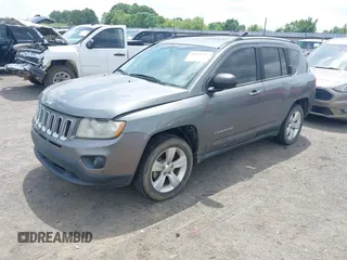 2011 Jeep Compass Latitude with VIN 1J4NT1FB4BD246549, listed as a IAAI auction lot 42156761 with 232,739 mi miles. Bid and sale history available at carsss.com. Image 2.