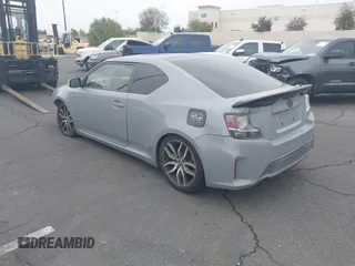 2014 Scion tC with VIN JTKJF5C71E3077886, listed as a IAAI auction lot 41939128 with 138,845 mi miles. Bid and sale history available at carsss.com. Image 3.