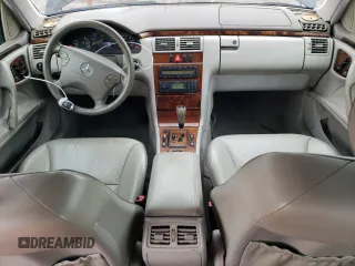 2000 Mercedes-Benz E-Class with VIN WDBJF65J5YB068297, listed as a Copart auction lot 69199004 with 236,751 mi miles and Salvage Title. Bid and sale history available at carsss.com. Image 8.