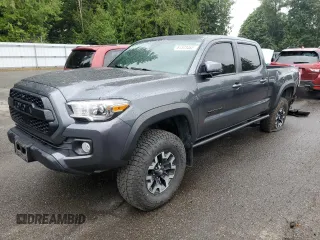 2020 Toyota Tacoma SR5 with VIN 3TMDZ5BN2LM097782, listed as a Copart auction lot 61573465 with 57,321 mi miles and Salvage title. Bid and sale history available at DreamBid. Image 1.