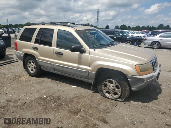 1999 Jeep Grand Cherokee Laredo with VIN 1J4GW58N7XC799434, listed as a Copart auction lot 64790905 with 272,384 mi miles and Salvage title. Bid and sale history available at DreamBid. Image 4.