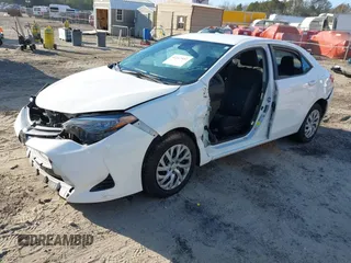 2019 Toyota Corolla L with VIN 5YFBURHEXKP934032, listed as a IAAI auction lot 41247557 with 95,560 mi miles. Bid and sale history available at carsss.com. Image 2.