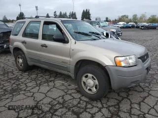 2001 Ford Escape XLS with VIN 1FMYU02111KA37010, listed as a Copart auction lot 52328415 with 312,425 mi miles and Salvage title. Bid and sale history available at DreamBid. Image 4.