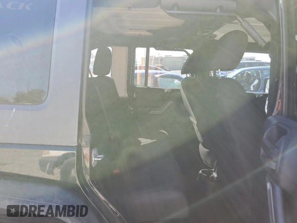 2014 Jeep Wrangler Unlimited Sport with VIN 1C4BJWDGXEL269693, listed as a Copart auction lot 46927895 with 105,691 mi miles and Salvage Title. Bid and sale history available at carsss.com. Image 11.