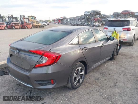 2019 Honda Civic Sedan LX with VIN 19XFC2F60KE018100, listed as a IAAI auction lot 41908486 with 124,357 mi miles. Bid and sale history available at carsss.com. Image 4.