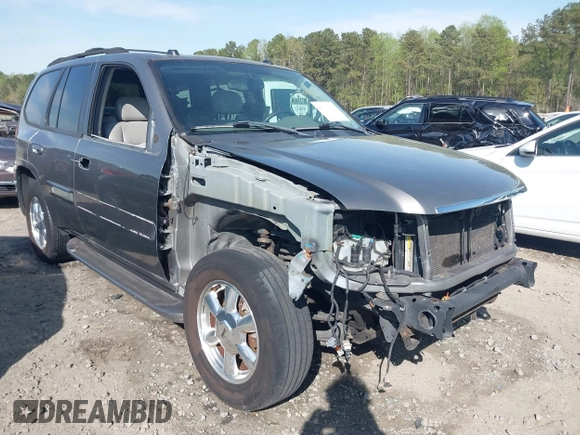 2005 GMC Envoy SLE with VIN 1GKDS13S452306939, listed as a IAAI auction lot 41931667 with 236,955 mi miles and . Bid and sale history available at DreamBid. Image 1.
