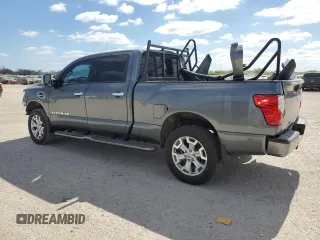2016 Nissan Titan XD PRO-4X with VIN 1N6BA1F47GN512757, listed as a Copart auction lot 77429314 with 152,756 mi miles and Salvage Title. Bid and sale history available at carsss.com. Image 2.