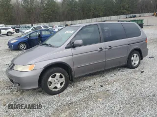 2000 Honda Odyssey EX with VIN 2HKRL1865YH513885, listed as a Copart auction lot 50223505 with 214,627 mi miles and Salvage Title. Bid and sale history available at DreamBid. Image 1.
