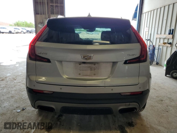 2019 Cadillac XT4 FWD Premium Luxury with VIN 1GYFZCR46KF198424, listed as a Copart auction lot 55465185 with 84,706 mi miles and Salvage title. Bid and sale history available at DreamBid. Image 6.