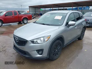 2014 Mazda CX-5 Touring z VIN JM3KE2CY8E0369145, wystawiony jako IAAI lot #42462985 z przebiegiem 155 480 mil mil oraz . Historia ofert i sprzedaży dostępna na DreamBid. Obrazek 2.