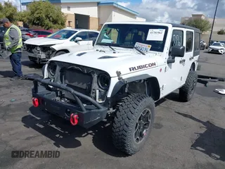 2016 Jeep Wrangler Unlimited Rubicon with VIN 1C4HJWFG7GL254143, listed as a IAAI auction lot 41781962 with 114,435 mi miles and . Bid and sale history available at DreamBid. Image 19.