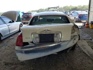 1999 Lincoln Town Car Executive with VIN 1LNHM81W2XY658371, listed as a Copart auction lot 60249045 with 191,266 mi miles and Salvage title. Bid and sale history available at DreamBid. Image 6.