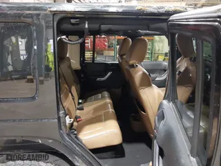 2011 Jeep Wrangler Unlimited Sahara with VIN 1J4HA5H12BL557059, listed as a IAAI auction lot 41856882 with 150,683 mi miles. Bid and sale history available at carsss.com. Image 8.