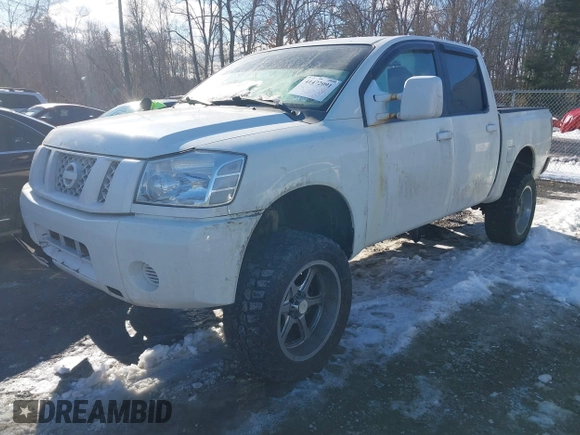 2012 Nissan Titan SV with VIN 1N6BA0EJ0CN309933, listed as a IAAI auction lot 41472091 with 147,635 mi miles. Bid and sale history available at carsss.com. Image 2.