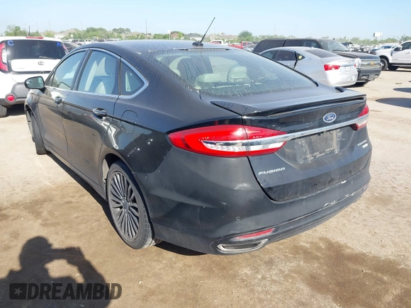 2017 Ford Fusion Titanium with VIN 3FA6P0K9XHR118057, listed as a IAAI auction lot 41982261 with 151,704 mi miles. Bid and sale history available at carsss.com. Image 3.