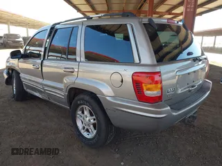2000 Jeep Grand Cherokee Limited z VIN 1J4GW58N1YC206992, wystawiony jako IAAI lot #42057236 z przebiegiem 183 986 mil mil oraz . Historia ofert i sprzedaży dostępna na DreamBid. Obrazek 3.