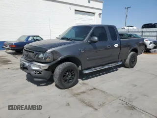2003 Ford F-150 XL with VIN 1FTRX18W63NA43394, listed as a Copart auction lot 59794065 with 227,179 mi miles and Salvage title. Bid and sale history available at DreamBid. Image 1.