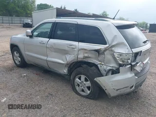 2011 Jeep Grand Cherokee Laredo with VIN 1J4RS4GGXBC564035, listed as a IAAI auction lot 41931861 with 242,291 mi miles and . Bid and sale history available at DreamBid. Image 3.
