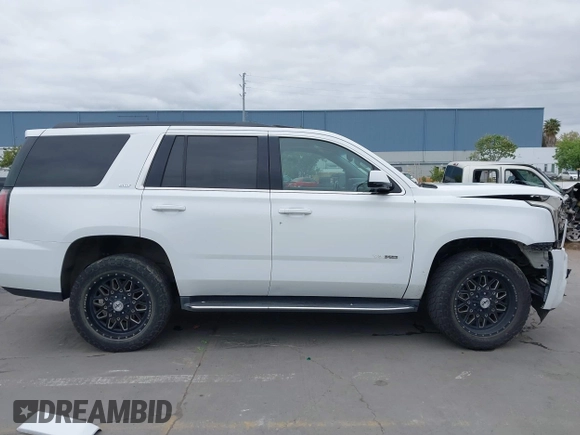 2019 GMC Yukon SLT with VIN 1GKS2BKC3KR160060, listed as a IAAI auction lot 42042122 with 124,733 mi miles. Bid and sale history available at carsss.com. Image 14.