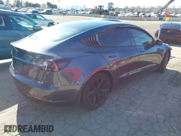 2022 Tesla Model 3 with VIN 5YJ3E1EA3NF165054, listed as a IAAI auction lot 41805729 with 225,773 mi miles. Bid and sale history available at carsss.com. Image 4.