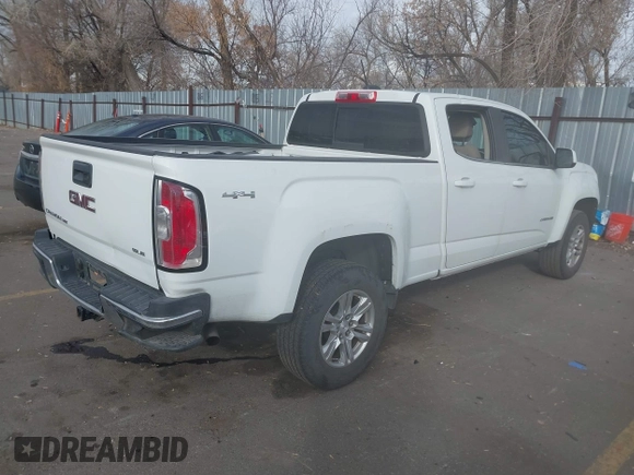 2019 GMC Canyon 4WD SLE z VIN 1GTG6CEN5K1297945, wystawiony jako IAAI lot #41308105 z przebiegiem 93 226 mil mil oraz . Historia ofert i sprzedaży dostępna na DreamBid. Obrazek 4.