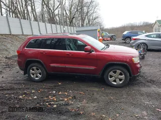 2012 Jeep Grand Cherokee Laredo with VIN 1C4RJFAG7CC123669, listed as a IAAI auction lot 42001472 with 164,806 mi miles. Bid and sale history available at carsss.com. Image 14.
