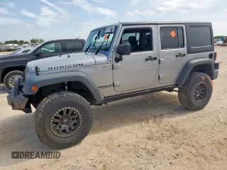 2015 Jeep Wrangler Unlimited Rubicon с VIN 1C4BJWFG0FL529310, выставлен на аукционе Copart как лот 64337405 с пробегом Не указан миль и Списание • Salvage title. История ставок и продаж доступна на DreamBid. Изображение 1.
