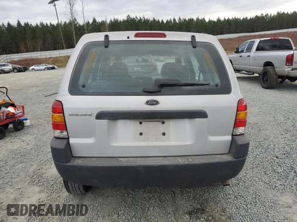 2004 Ford Escape with VIN 1FMCU02144KB63439, listed as a Copart auction lot 85310514 with 275,625 mi miles and Salvage title. Bid and sale history available at DreamBid. Image 6.