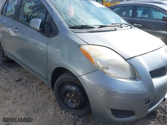 2010 Toyota Yaris with VIN JTDKT4K33A5293606, listed as a IAAI auction lot 41574444 with 262,584 mi miles. Bid and sale history available at carsss.com. Image 13.