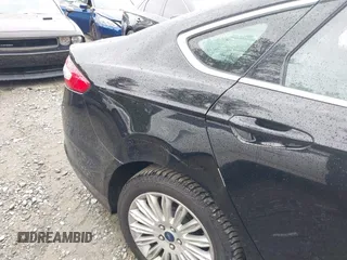 2016 Ford Fusion Energi SE Luxury with VIN 3FA6P0PU7GR293099, listed as a IAAI auction lot 42079873 with 194,755 mi miles. Bid and sale history available at carsss.com. Image 6.